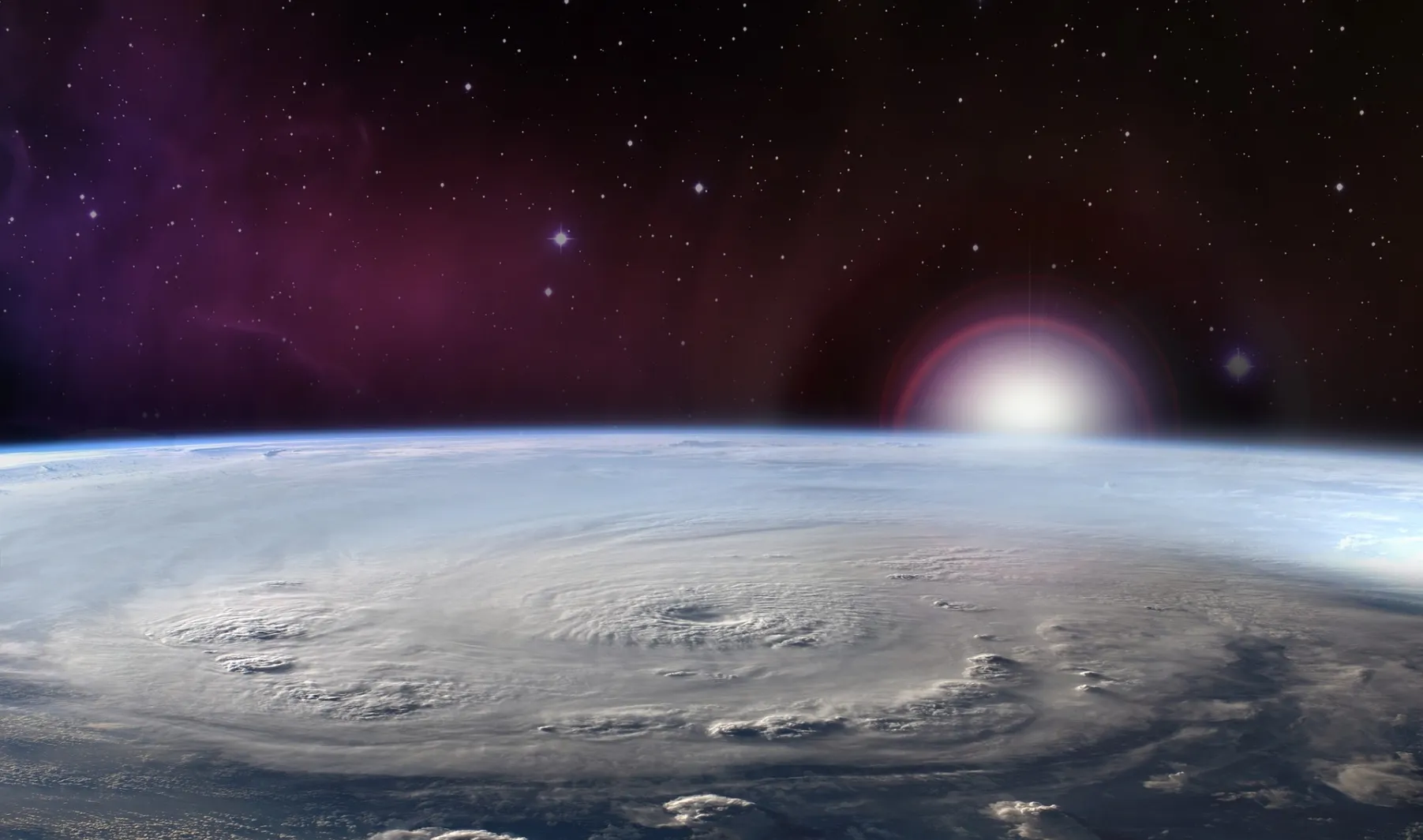 Earth as seen from space, with a radiant sun illuminating the planet, showcasing the presence of hurricanes.