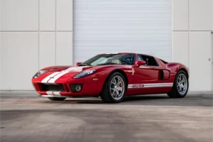 Red sports car with white stripe.