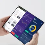 Person holding a futuristic foldable phone with a multitasking display.